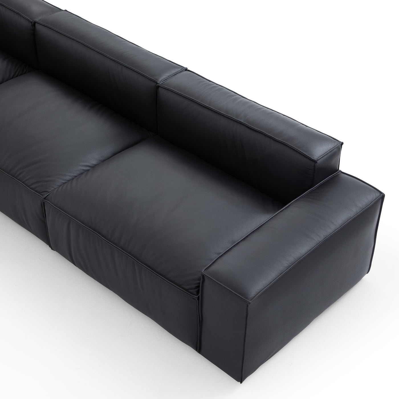 Luxury Minimalist Black Leather Sectional and Ottoman-Black-145.7"-Facing Left